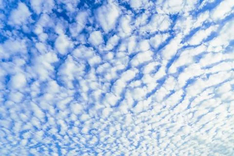Clouds are blown up in the blue sky in the morning. Stock Photos