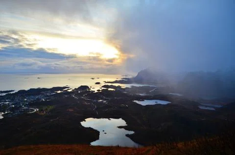 Clouds are bringing snowfall on the top of the mountain Stock Photos