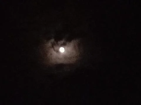 Clouds are covering the moon Stockfoto's