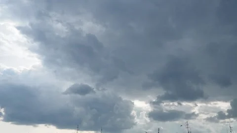 Clouds are floating across the sky, rain is gathering. Weather is getting worse Stock Footage 281008101
