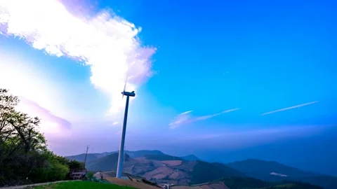 Clouds are flowing behind the wind generator. Stock Footage 123150519