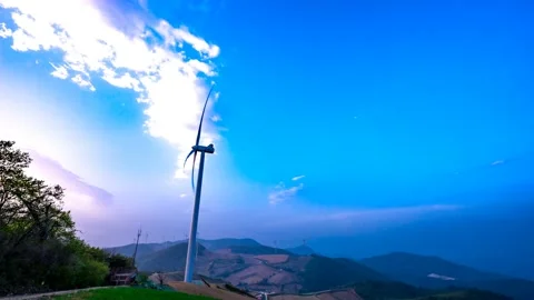Clouds are flowing behind the wind generator. 스톡 동영상 123150613