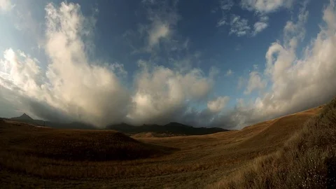 Clouds are flying from the mountains Stock Footage 72772600
