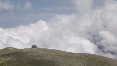 Clouds are flying over a refuge on "Valley of the Muses", Mount Olympus, Greece. Stock Footage 96705449