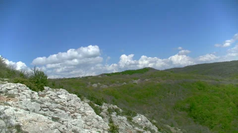 Clouds are hurrying past a rocky landscape timelapse Stock Footage 50759607