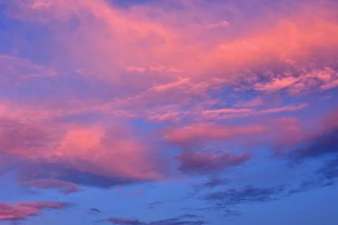 The clouds are lit by the setting sun. Stock Photos