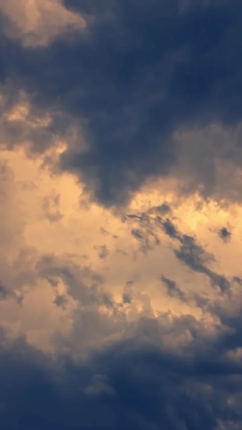 Clouds are moving in a dramatic sky during sunset. Time-lapse, Vertical video Stock Footage 280658028