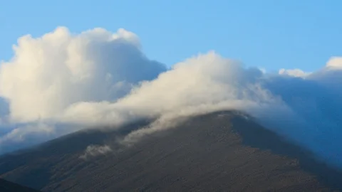 Clouds are moving over mountain peak Stock Footage 118083266