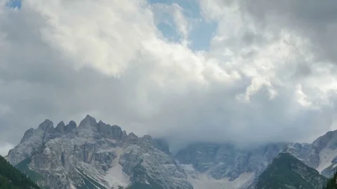 Clouds are Moving over the Top of the Alpine Mountains. TimeLapse. Stock Footage 82957135