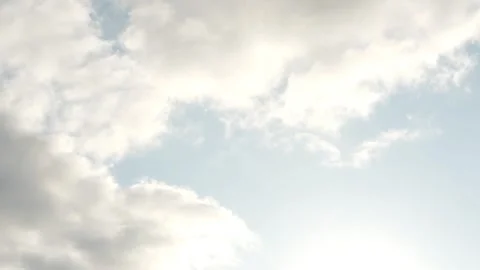 Clouds are passing fast in front of a beautiful blue sky Stock Footage 244369783