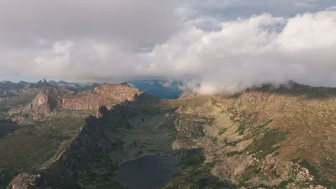 Clouds are passing over the ergaki nature park mountain range Stock Footage 300900284