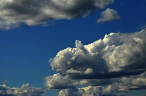 Clouds are photographed. It is a cloud formed in the form of a lying dog Stock Photos