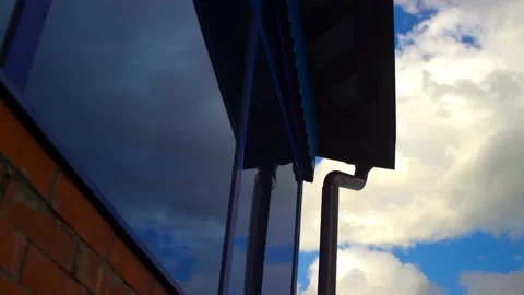 Clouds are reflected in the blue glass Time lapse 4k Stock-Footage 212805083