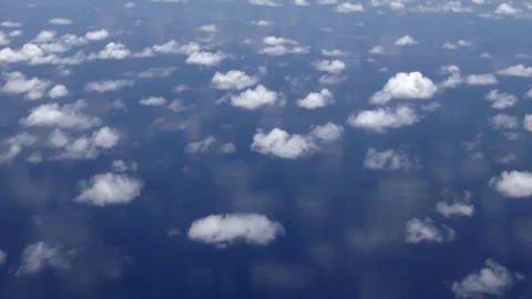 Clouds are reflected on the surface of the ocean, Aerial shot in Indian Ocean Stock Footage 74365032