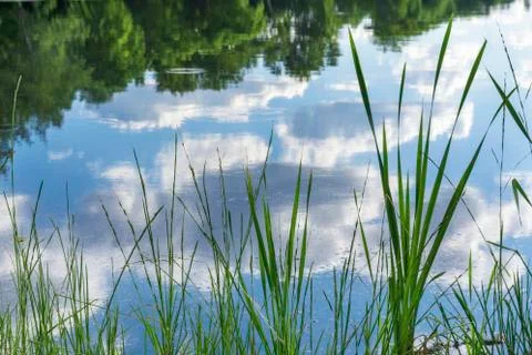 Clouds are reflected in the water. Stock Photos