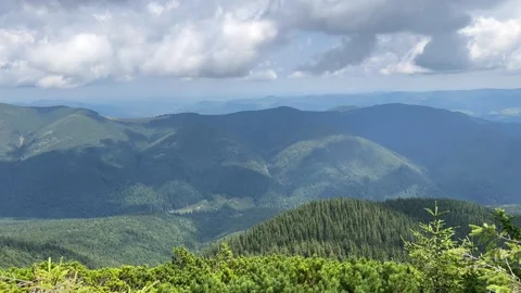 Clouds are slowly covering the mountain ridges Stock Footage 281971977