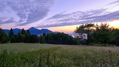 Clouds are slowly moving over the Carpathian spring nature, a green meadow Stock Footage 301647761
