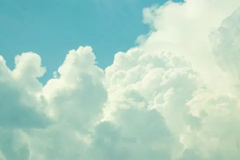 Clouds are white because light from the Sun is white and little blue skylight Stock Photos