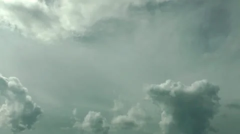 Clouds arising anywhere and scattering in different directions. Time lapse Stockbeeldmateriaal 12326564