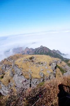 Clouds around the mountainsides of high mountain Stock Photos