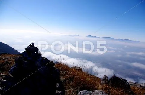 Clouds around the mountainsides of high mountain Stock Photos