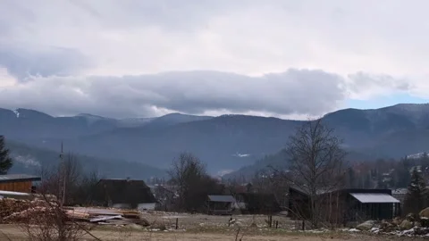 Clouds in the autumn blue mountains Stock Footage 257075436