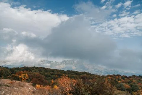Clouds in the autumn mountains Stock Photos