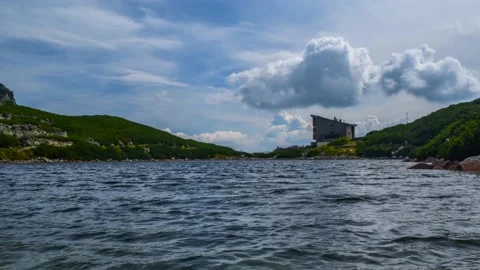 Clouds in the backgroud of mountain lake Stock Footage 132240519