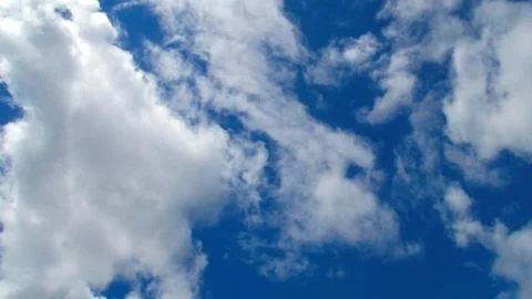 Clouds on a background of blue sky. Stock Photos