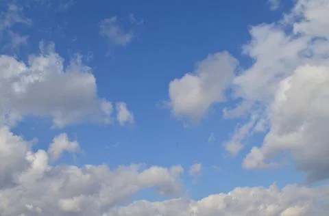 Clouds on a background of blue sky. Stock Photos