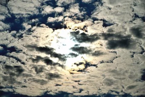 Clouds on the background of bright blue sky, summer day close-up Stock Photos