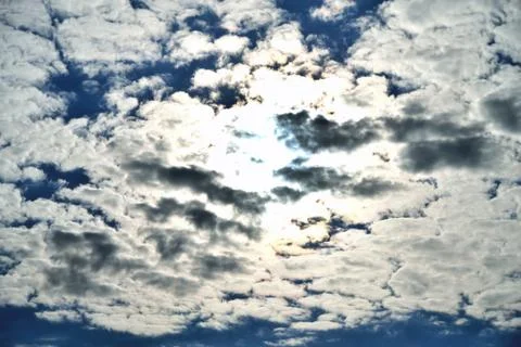 Clouds on the background of bright blue sky, summer day close-up Stock Photos