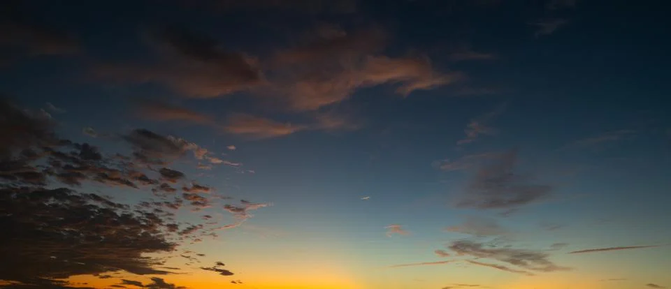 Clouds background. Dramatic Clouds Sunset Background. Sky with clouds in Sunrise Stock Photos