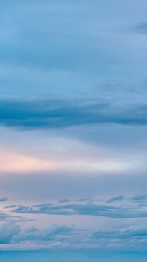 Clouds background. Sunset.  Vertical Time lapse Stock Footage 235609179