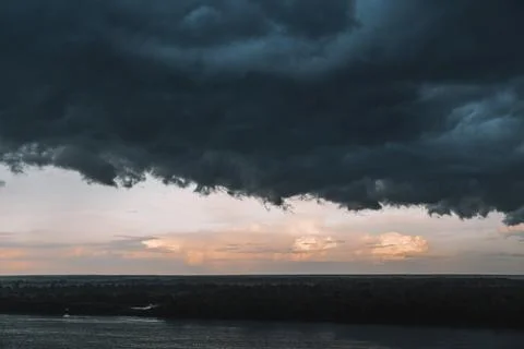 Clouds with background,sunlight through very dark clouds background of dark.. Stock Photos