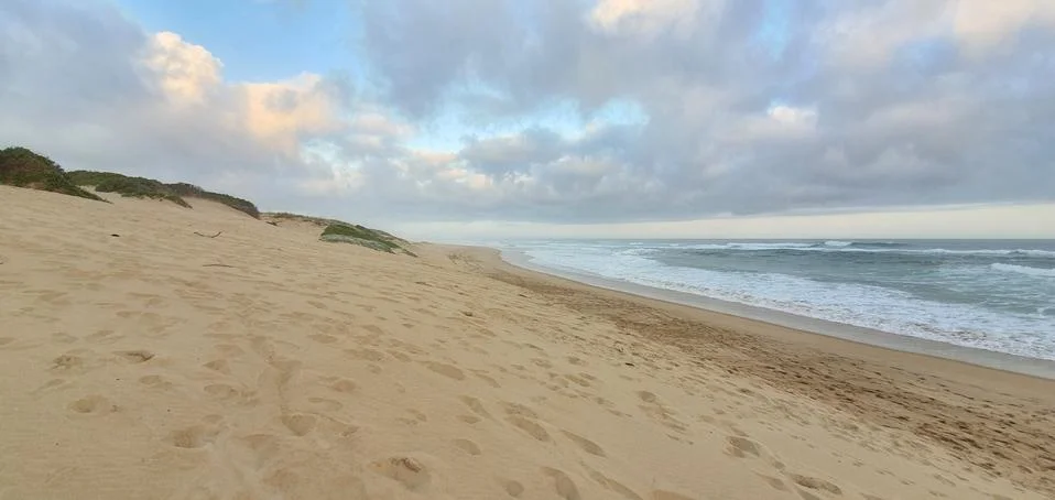 Clouds at the beach Stock Photos