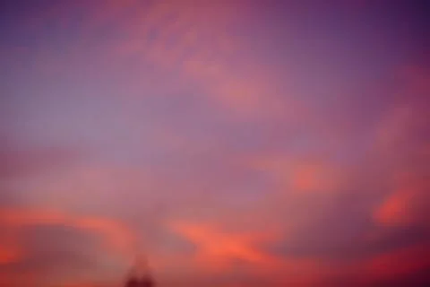 Clouds of beautiful color in the fall. Sunset pink red orange color. Stock Photos