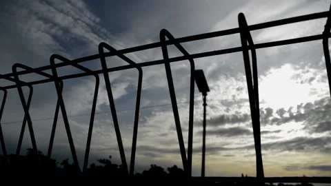 Clouds behind the iron fence Video stock 236813497