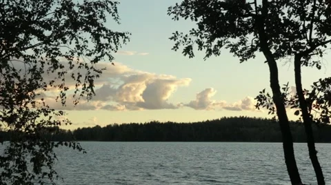 Clouds behind a lake timelapse Stock Footage 54541307