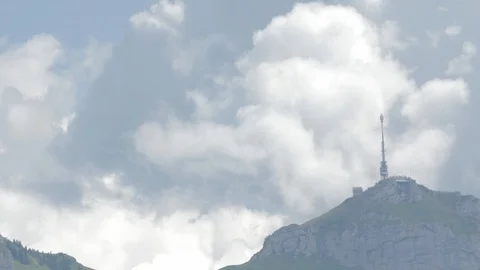 Clouds behind a mountain with mountain station Stock Footage