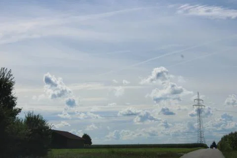 Clouds behind a powerline Stock Photos