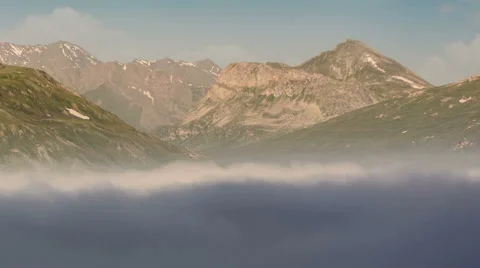 Clouds below mountain peaks Lac du Mont Cenis artificial lake Stock Footage 53513225
