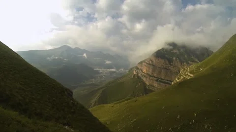 Clouds below the mountains in a mountainous area Stock Footage 196242179
