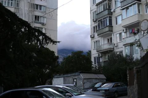 Clouds between houses Stock Photos