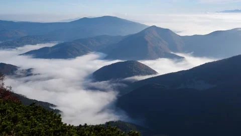 Clouds between the mountains, inversion, Magic of the mountains, high altitude, Stock Footage 194108135