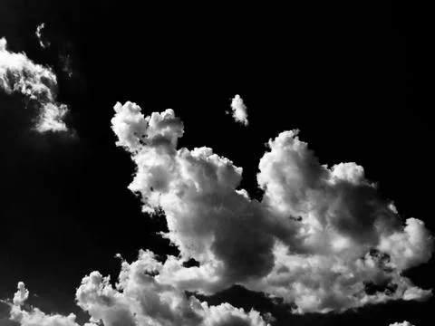 Clouds. Black Background. Isolated white clouds on black sky. Set of isolated Stock Photos