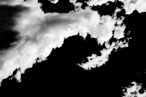 Clouds on black background Stock Photos