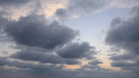 The clouds of black rain move slowly in the sun near the ground. Stock-Footage 104484539