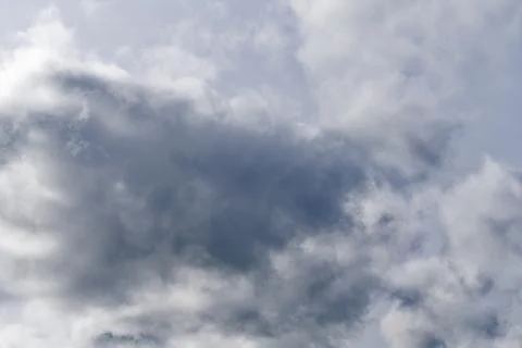Clouds blanket the sky, indicative of possible weather transitions. Stock Photos