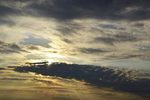 Clouds block the sun at sunset. Signs of worsening weather. Stock Photos